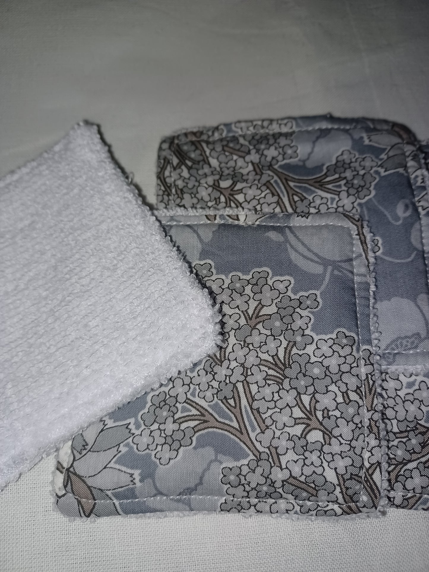 Silver and grey make up remover pads