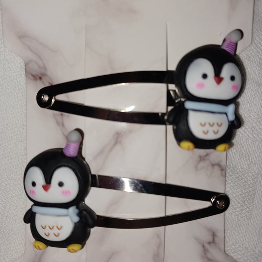 Penguin in a party hat hair clip pair