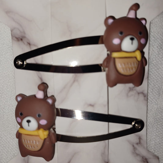 Teddy bear in a party hat hair clip pair